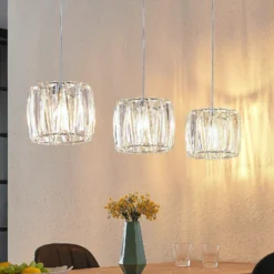 Lámpara colgante Sofia de Lindby, 107 cm, 3 luces, E14, cromo/claro