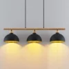 Lámpara colgante Tirzana de Lindby, 3 luces, negra, metal, madera