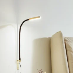 Lámpara de lectura LED Lindby Flexola, dorada, redonda, metal, enchufe