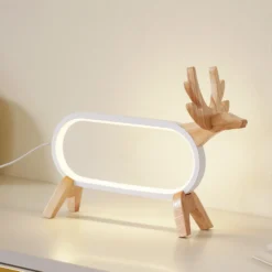 Lámpara de mesa LED Lindby Hirvi, blanca, madera, 31 cm, CCT, atenuable