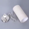Lámpara de mesa Lindby Ronja, altura 26 cm, color crema, textil