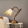 Lámpara de mesa Lucrezia en bronce con pantalla floral