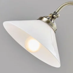 Lámpara de mesa Otis de Lindby, latón antiguo, cristal, 60 cm, E14