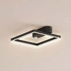 Lámpara de techo LED Yulla de Lindby, 34 cm, negra, con sensor