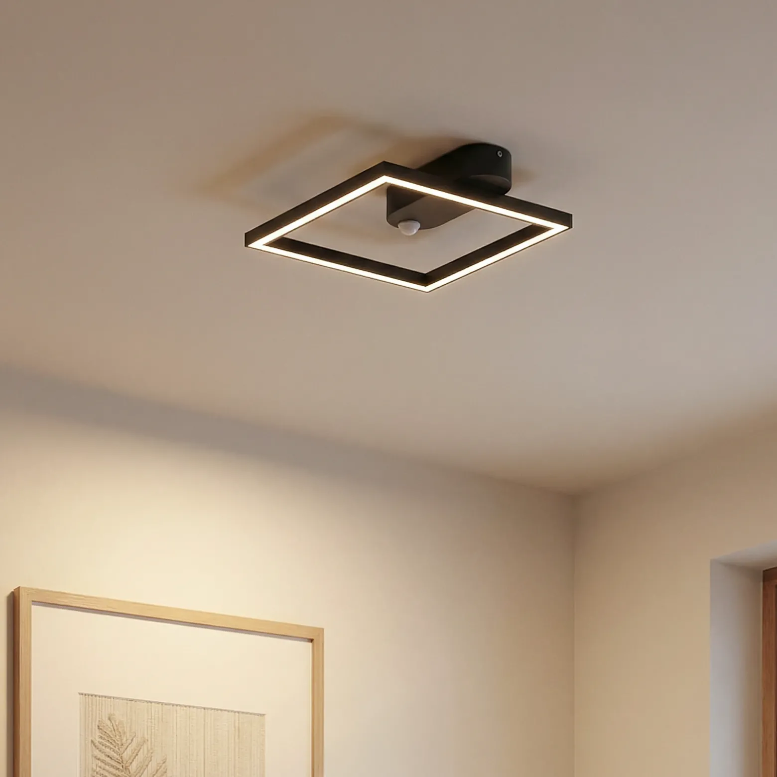 Lámpara de techo LED Yulla de Lindby, 34 cm, negra, con sensor