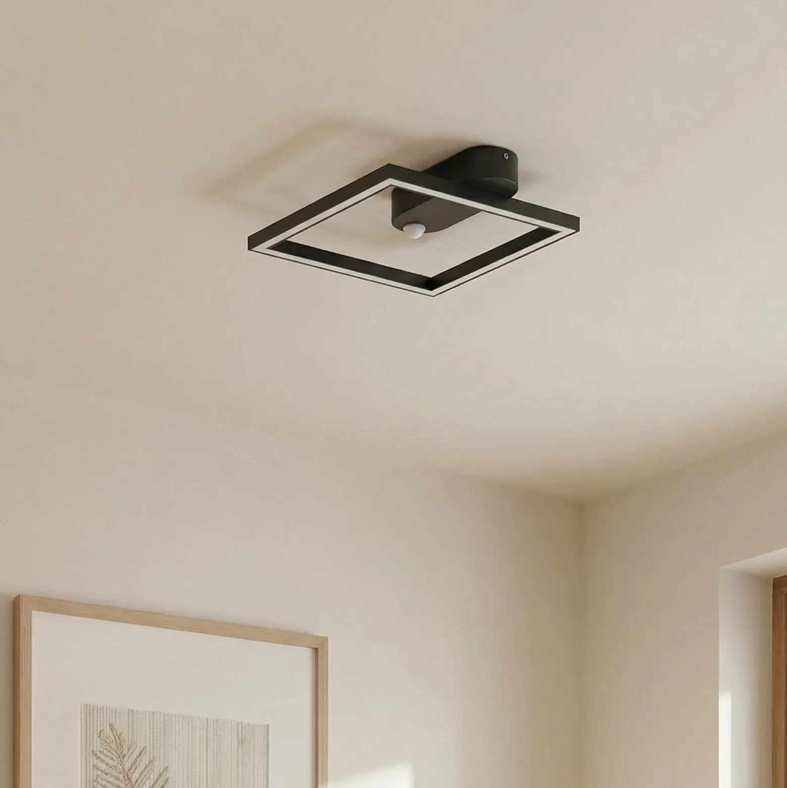 Lámpara de techo LED Yulla de Lindby, 34 cm, negra, con sensor