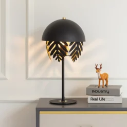 Lucande Aparas lámpara de mesa look hoja, negro-oro