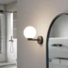 Lucande aplique de pared Bidolo, negro, cristal, Ø 12 cm, IP44