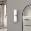 Lucande Basolo aplique para baño, cromo, altura 31,5cm, cristal, IP44