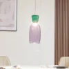 Lucande Lámpara colgante LED Fay, púrpura/verde oscuro, cristal, Ø 15 cm