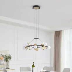 Lucande Lámpara colgante LED Pallo, 12 luces, negro/oro, cristal