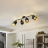 Plafón Lindby Aralena, negro/oro, 4 luces, longitud 97cm