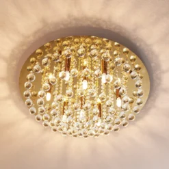 Plafón Lindby Gillion, 8 luces, dorado, cristal, Ø 55cm