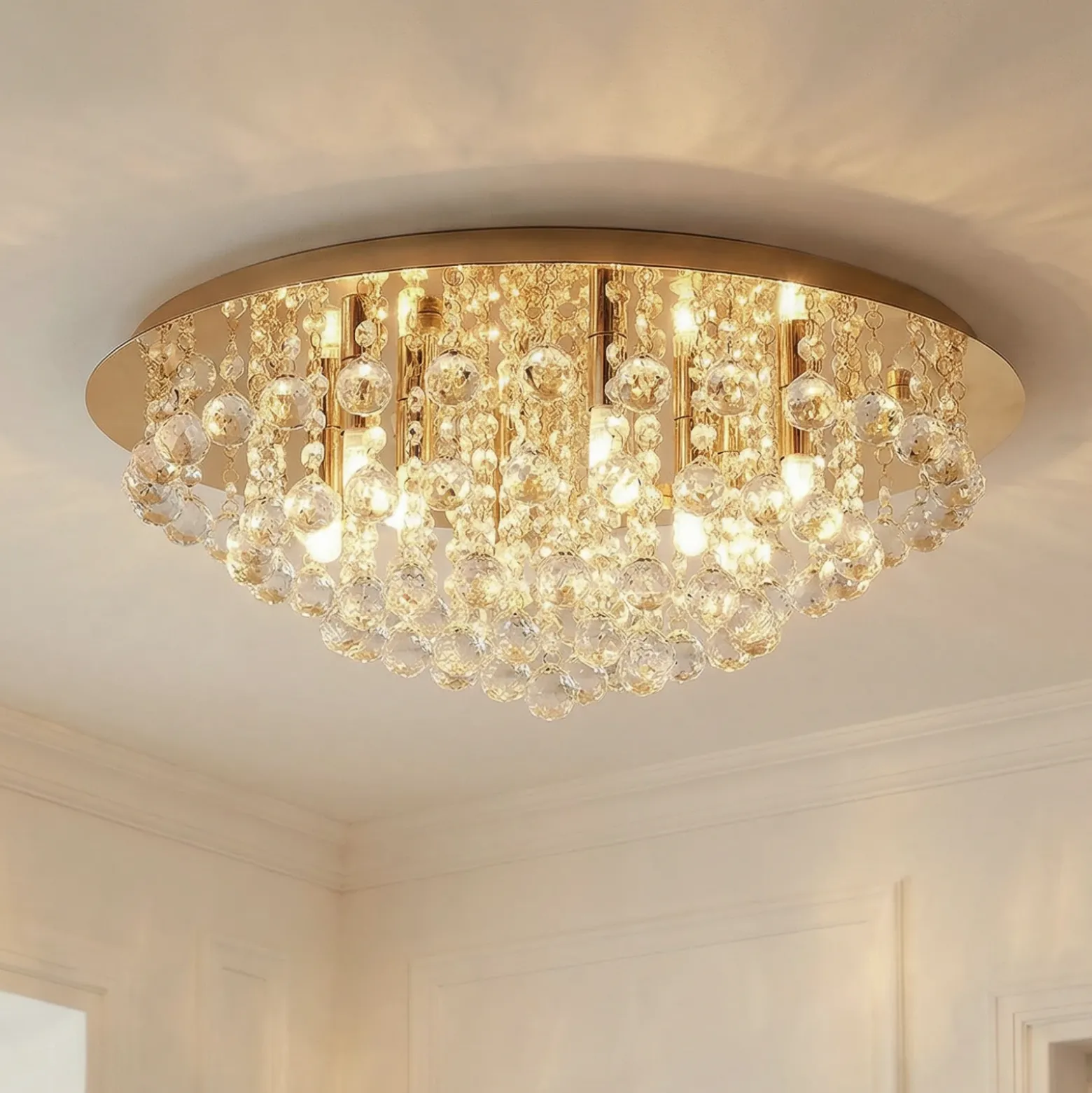 Plafón Lindby Gillion, 8 luces, dorado, cristal, Ø 55cm