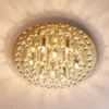 Plafón Lindby Gillion, 8 luces, dorado, cristal, Ø 55cm