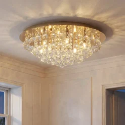 Plafón Lindby Gillion, 8 luces, dorado, cristal, Ø 55cm