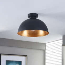 Plafón Lindby Lya, Ø 31 cm, negro-oro, metal, E27